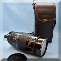 E30. Sigma Telephoto lens in case 67mm - $90 